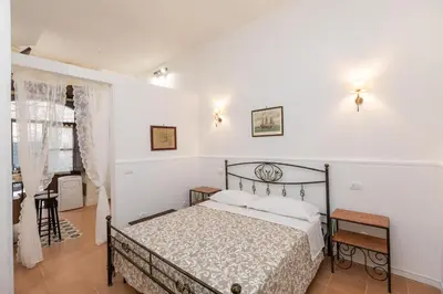 Letto o letti in una camera di Casa Ariadne by Ortigia Apartments