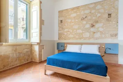 Letto o letti in una camera di A Casa di Fra by Wonderful Italy