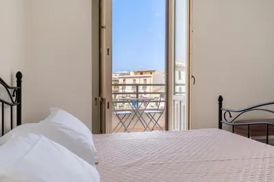Letto o letti in una camera di Casa all'Arsenale Greco by Wonderful Italy