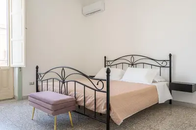 Letto o letti in una camera di Casa all'Arsenale Greco by Wonderful Italy