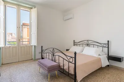 Letto o letti in una camera di Casa all'Arsenale Greco by Wonderful Italy