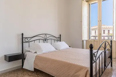 Letto o letti in una camera di Casa all'Arsenale Greco by Wonderful Italy