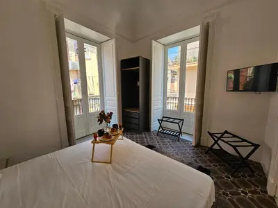 Letto o letti in una camera di Grey House Apartments