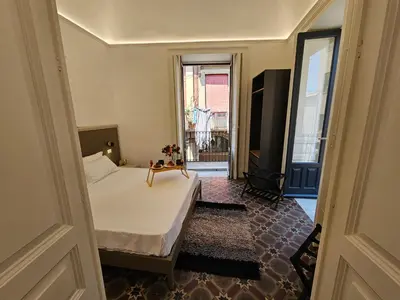 Letto o letti in una camera di Grey House Apartments