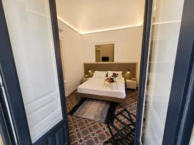 Letto o letti in una camera di Grey House Apartments