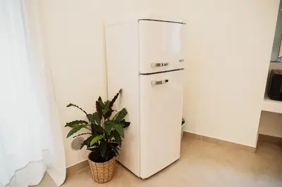Cucina o angolo cottura di OAZA Design Apartments Jacuzzi Suite or Shower City Center Catania