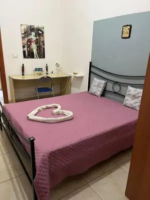 Letto o letti in una camera di Fra il centro e il mare