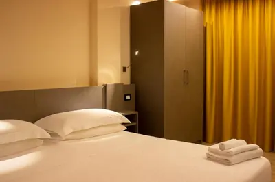Letto o letti in una camera di KRINO' hotel cafè