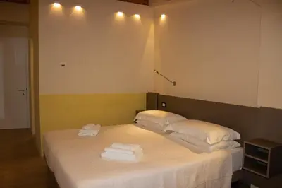 Letto o letti in una camera di KRINO' hotel cafè
