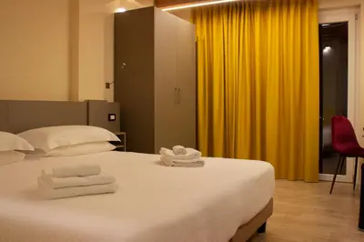 Letto o letti in una camera di KRINO' hotel cafè
