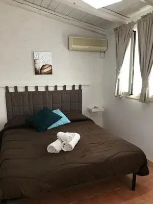 Letto o letti in una camera di Casa della Loggia