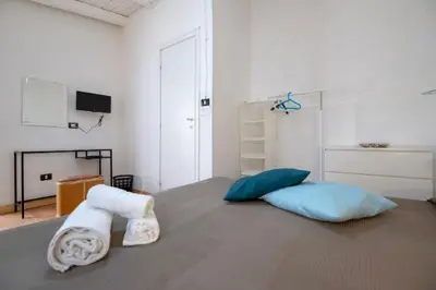 Letto o letti in una camera di Casa della Loggia