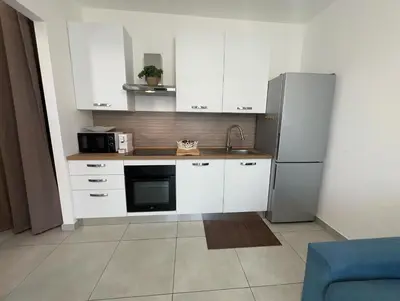 Cucina o angolo cottura di Le Voyage Holiday Home Marzamemi