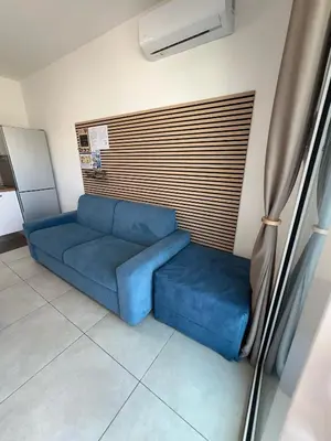 Area soggiorno di Le Voyage Holiday Home Marzamemi