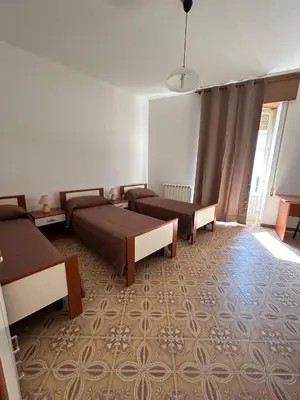 Letto o letti in una camera di La Casa di Modica