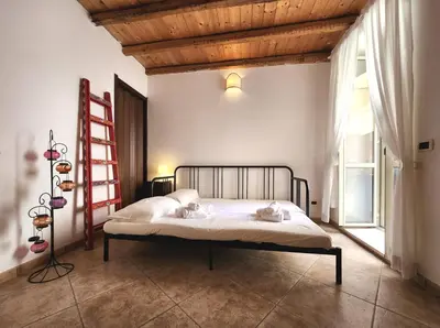 Letto o letti in una camera di Il Cortile di Dioniso