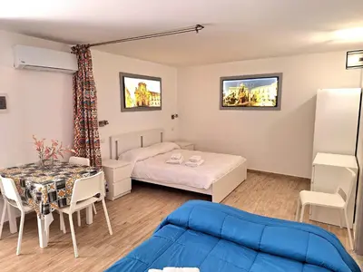 Letto o letti in una camera di Nata Sicula