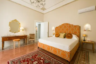 Letto o letti in una camera di Donna Laura Apartments - Charme Sicilian Living