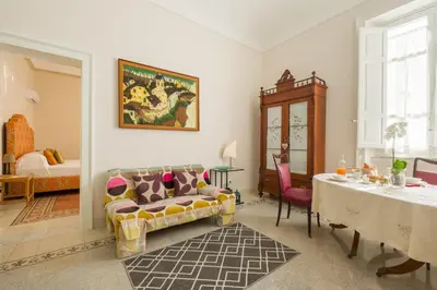 Area soggiorno di Donna Laura Apartments - Charme Sicilian Living