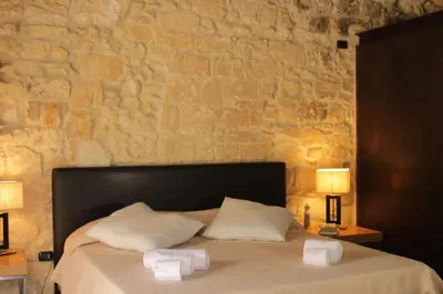 Letto o letti in una camera di Il Carosello dei Baroni