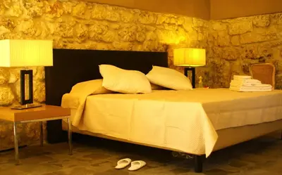Letto o letti in una camera di Il Carosello dei Baroni