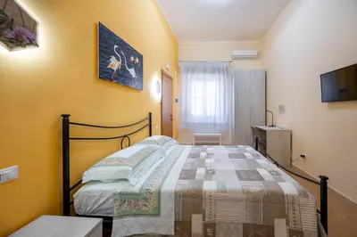 Letto o letti in una camera di Il cappello sulle 23! Camere in affitto breve