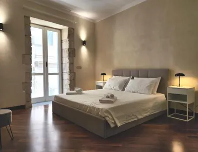 Letto o letti in una camera di Candemira - Ortigia Marina Apartment