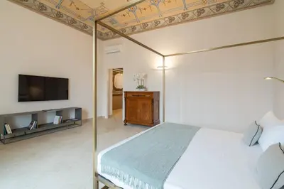 TV o dispositivi per l'intrattenimento presso Palazzo Pupillo fine apartments by Dimore in Sicily
