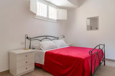 Letto o letti in una camera di Russu Suli Apartments by Wonderful Italy