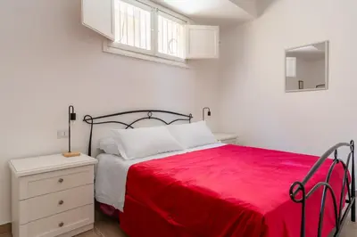 Letto o letti in una camera di Russu Suli Apartments by Wonderful Italy