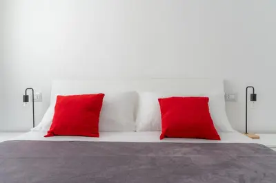 Letto o letti in una camera di Russu Suli Apartments by Wonderful Italy
