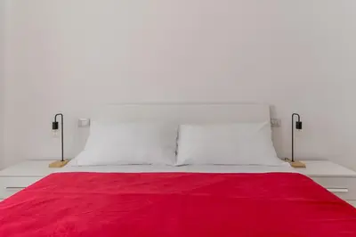Letto o letti in una camera di Russu Suli Apartments by Wonderful Italy