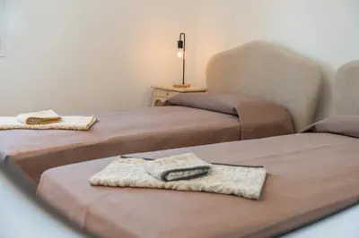 Letto o letti in una camera di Villa Le Tre Muse Beach