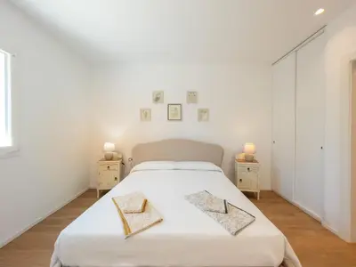 Letto o letti in una camera di Villa Le Tre Muse Beach