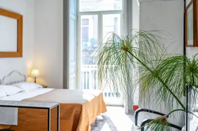 Letto o letti in una camera di GuestHost - Elegant Apartment near Castello Ursino