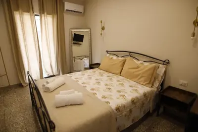 Letto o letti in una camera di Amuri