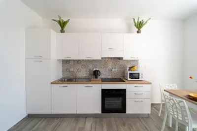 Cucina o angolo cottura di GuestHost - Borgo 84 Marzamemi - Casa di Antonio