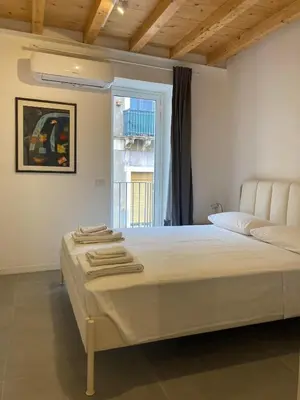 Letto o letti in una camera di Casa Itema