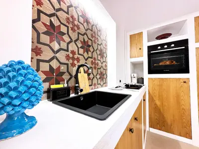 Cucina o angolo cottura di La Formica - Catania City Center Apartment