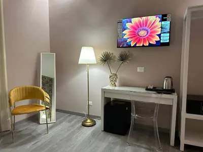 TV o dispositivi per l'intrattenimento presso Etnea Boutique Hotel