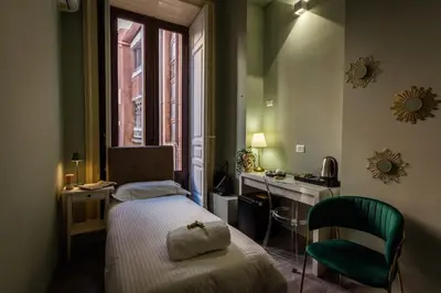 Letto o letti in una camera di Etnea Boutique Hotel