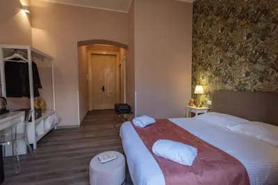 Letto o letti in una camera di Etnea Boutique Hotel
