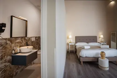 Letto o letti in una camera di Etnea Boutique Hotel