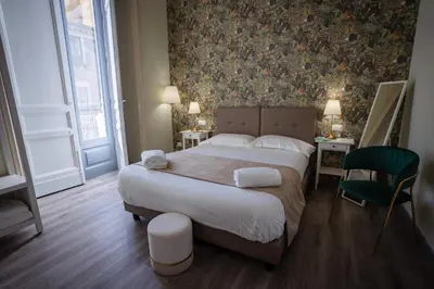 Letto o letti in una camera di Etnea Boutique Hotel