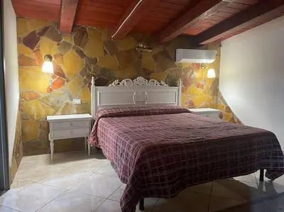 Letto o letti in una camera di Domus Zeus