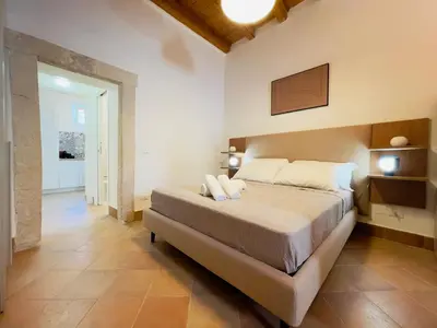 Letto o letti in una camera di La Casetta Di Simona