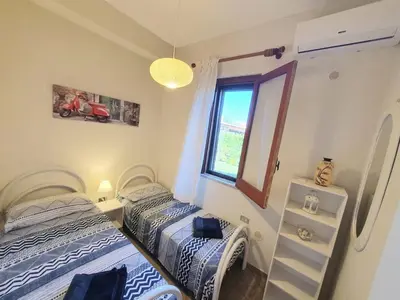 Letto o letti in una camera di Appartamenti Villa Augusta-del-Sol