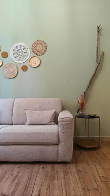 Area soggiorno di Il sussurro delle Nereidi, appartamento boho-chic a Siracusa