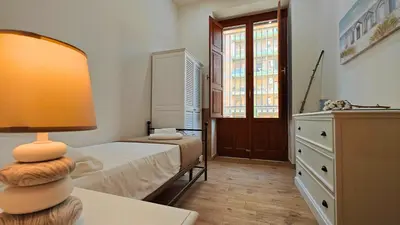 Letto o letti in una camera di Il sussurro delle Nereidi, appartamento boho-chic a Siracusa