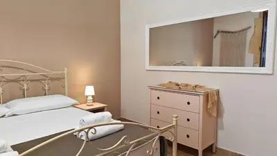 Letto o letti in una camera di Il sussurro delle Nereidi, appartamento boho-chic a Siracusa
